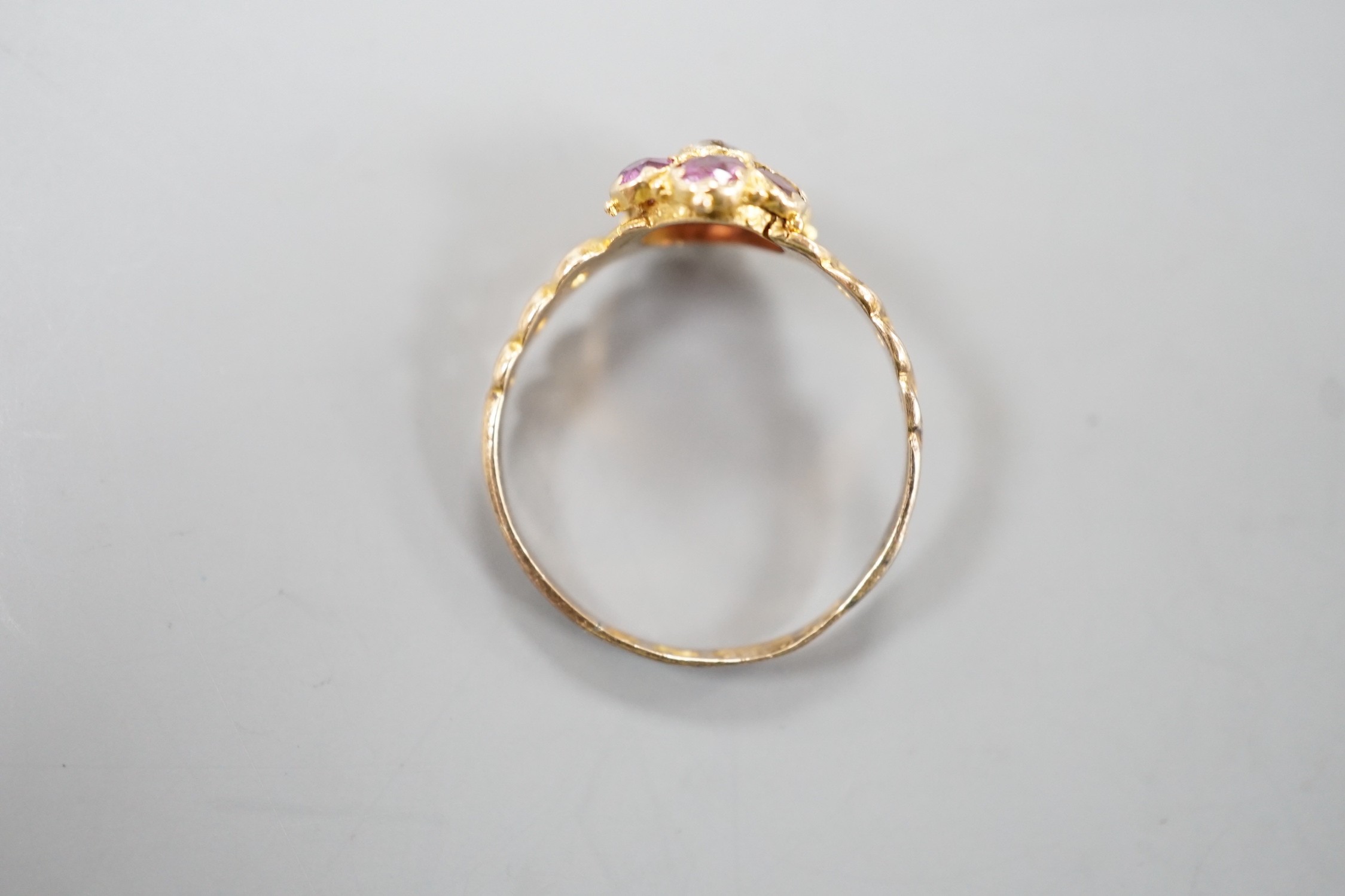 A late Victorian 15ct gold amethyst and quartz? cluster set dress ring, size P, gross weight 1.3 grams, with pierced ring shoulders.